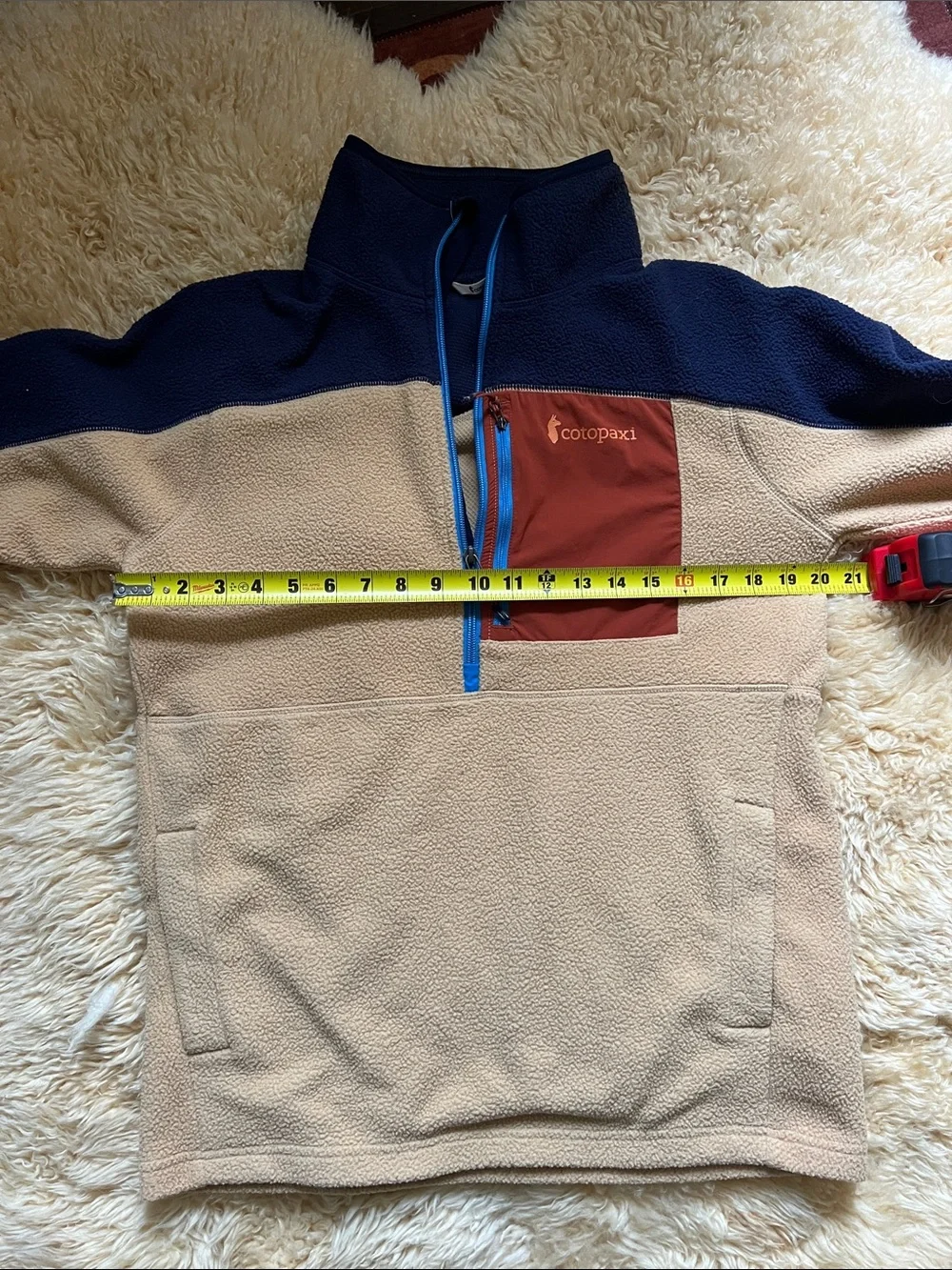 Cotopaxi Men’s Tan and Navy Fleece Half-Zip with Rust Chest Pocket